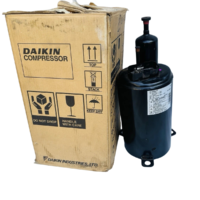 Daikin RC112YENE hermetic refrigeration compressor standing next to original Daikin factory box
