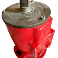 Right-side view of a red Damcos BRC hydraulic actuator, showing its bolted base.