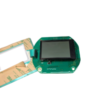 Unassembled Honeywell Enraf SmartView display PCB with mounted LCD screen, showing connecting ribbon cable and adhesive gasket backing.