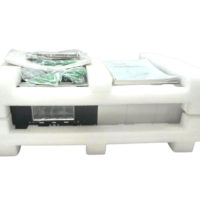 Honeywell enCore FC-MC1 flow computer packed in foam inserts with manual and connectors
