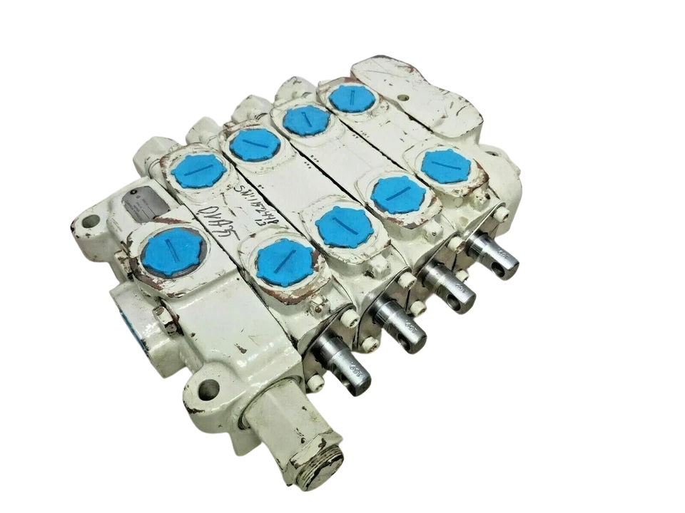 Parker Commercial DVA35 Hydraulic Control Valve1 Parker Commercial DVA35 4-spool hydraulic directional control valve with clevis spools and capped ports.
